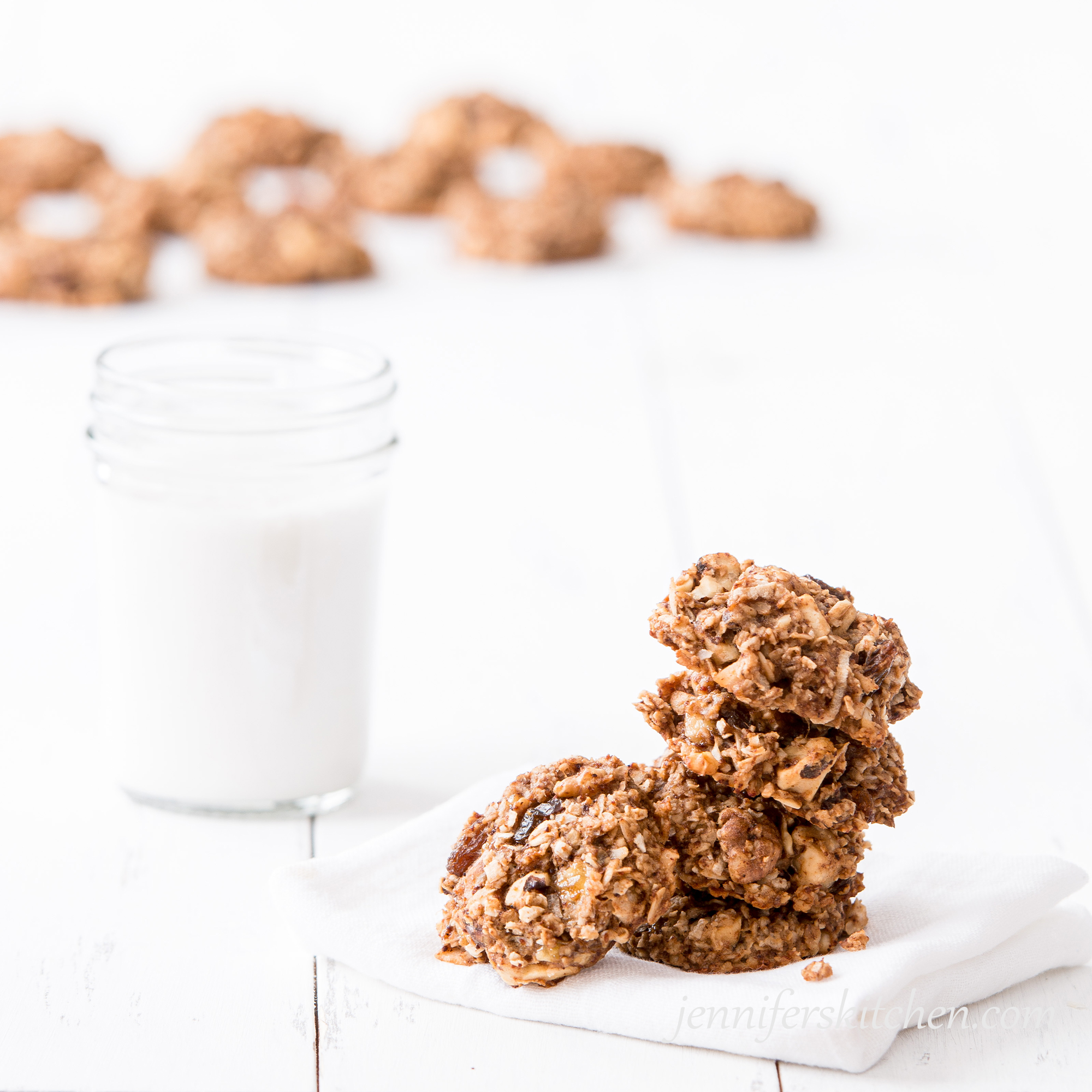 Stack of Sugar-Free Banana Breakfast Cookies  with glass of non-dairy milk on the side.