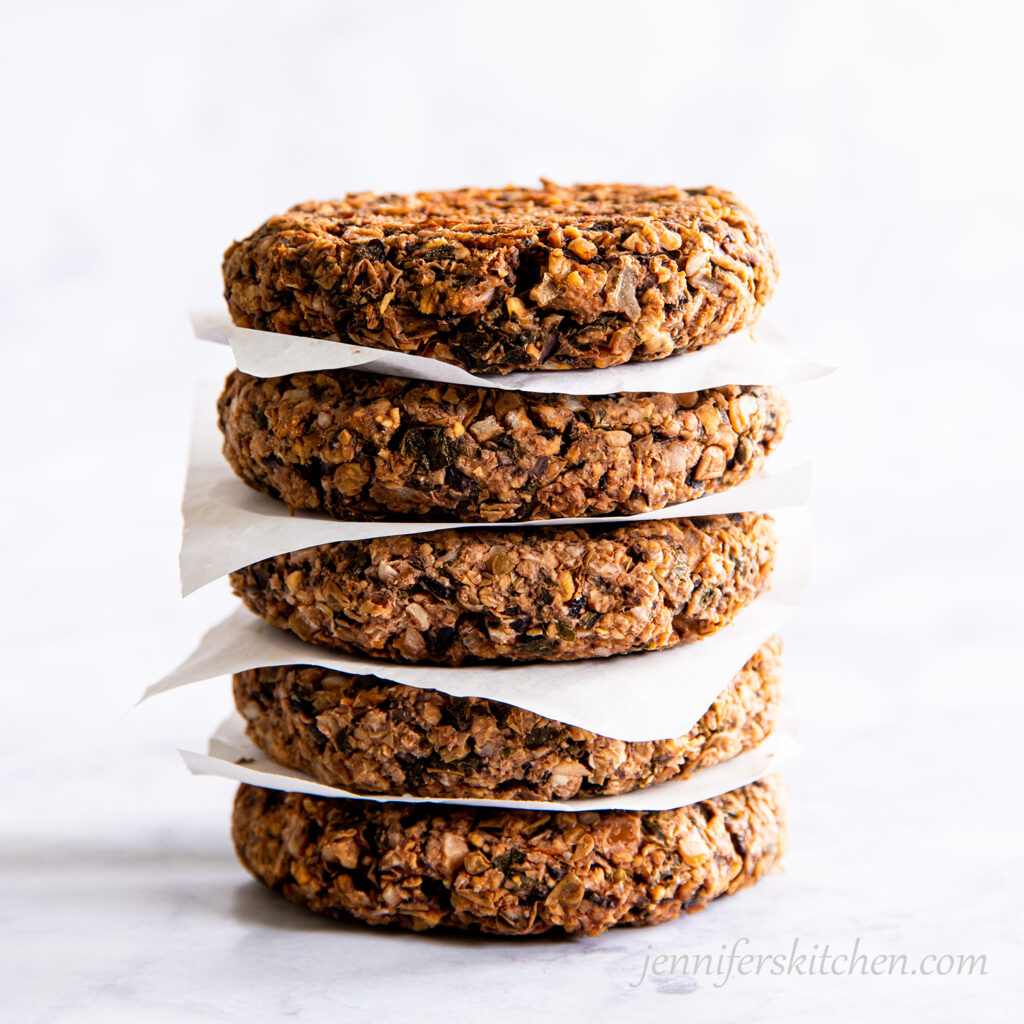 Walnut Pesto Burgers in a stack ready to enjoy.