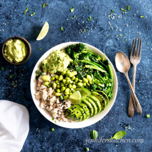 Coconut Rice Veggie Bowl with avocado sauce and limes
