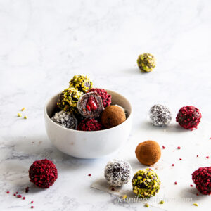 Fudgy Raspberry-Filled Cookies in a bowl with one opened and ready to eat!
