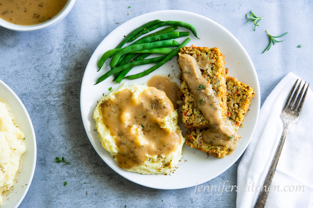 Chickpea Gravy over mashed potatoes and veggie loaf with greens beans on the side.