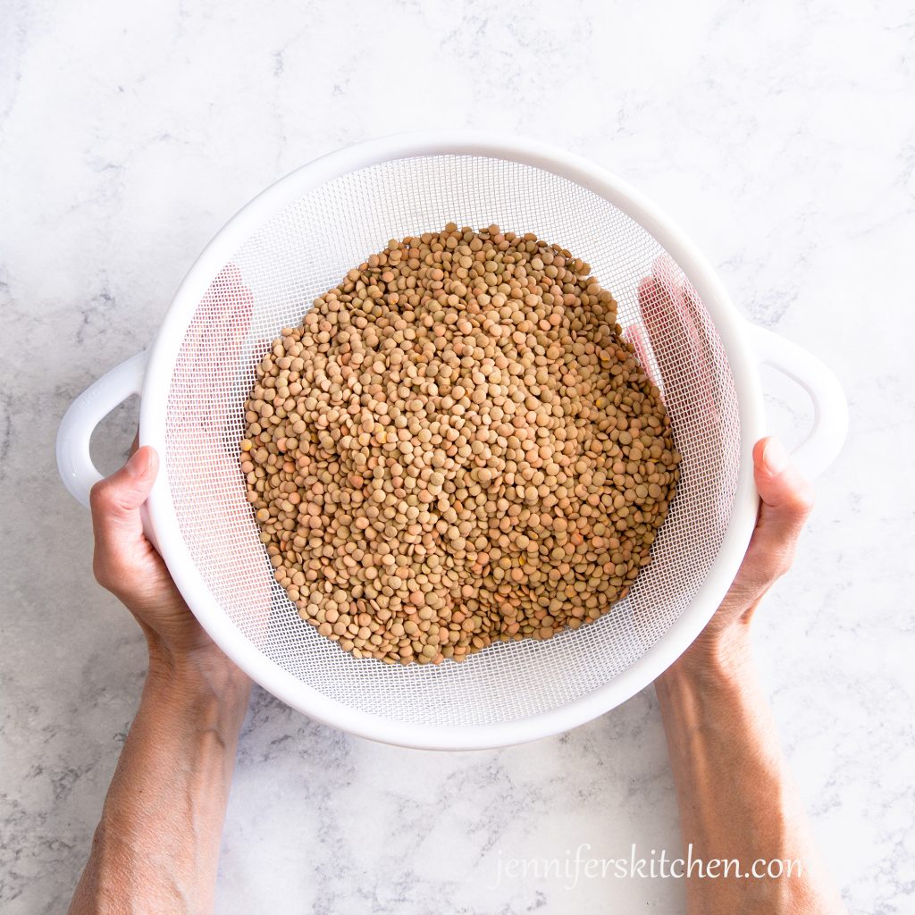 lentils in a colander ready to rinse