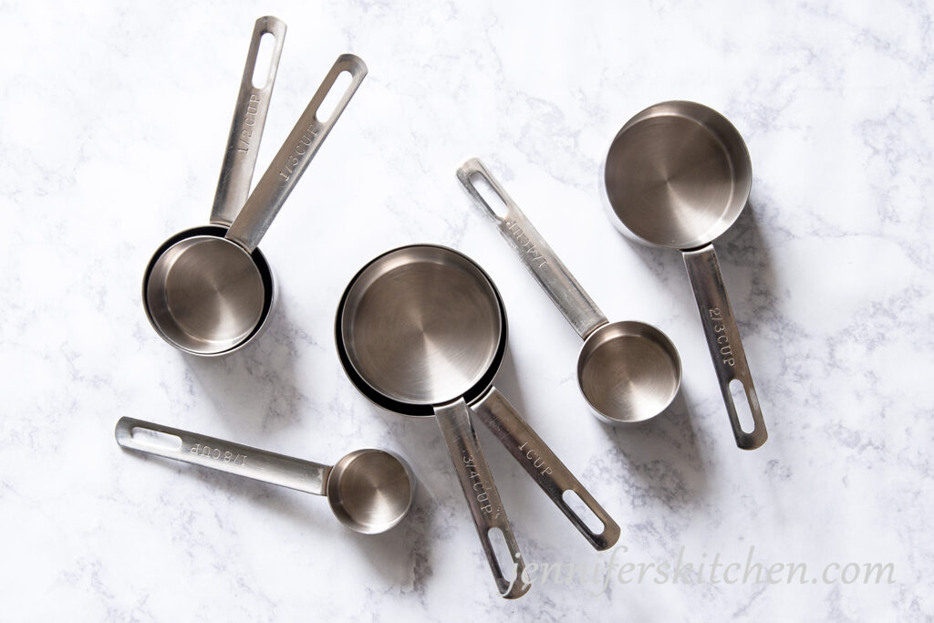 Measuring cups on a marble background